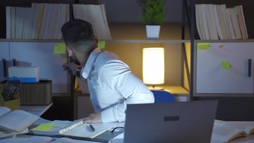 Young Adult Working Late Night in Office