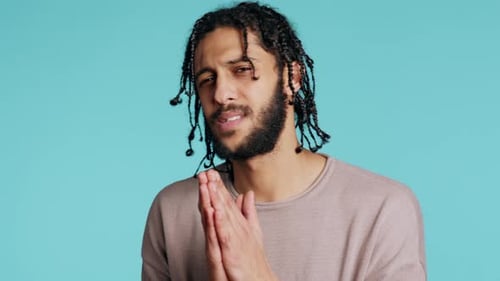 Man with Braids Begging, Praying with Hands Clasped