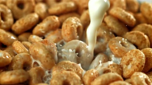 Milk Pouring Into Toasted Cereal Rings