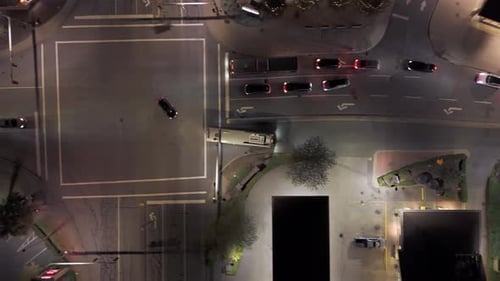 Vertical Top Down Aerial View - Driving Bus Tracking at Nighttime