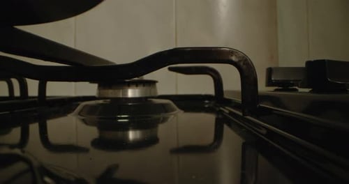 A Closeup of the Ignition of a Gas Stove The Fire Burns for Cooking at Home