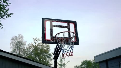 Steady shot of basketball hoop scoring a point.