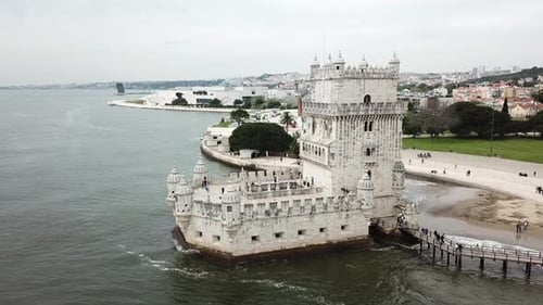 Lisbon, Belem tower's drone footage zooming in from the right hand side of the tower where the pedes