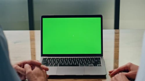 Business Team Using Green Screen Laptop at Lobby Closeup. Anonymous Coworkers Working