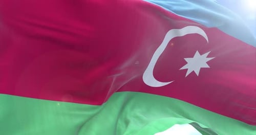 Waving Flag of Azerbaijan against Blue Sky