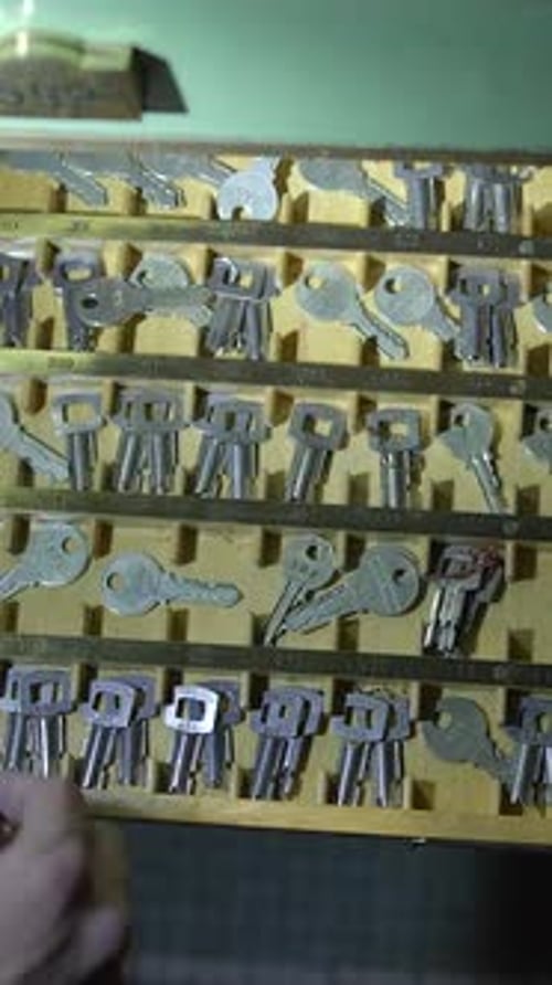 Hand Opens Safe Deposit Box with Stacks of Cash