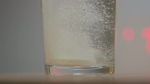 Effervescent Tablet Dissolving in a Glass of Water