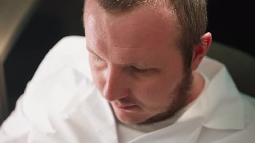 Tired Scientist Resting in Lab Coat and Gloves