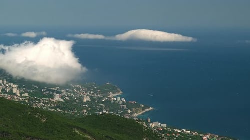 A Vibrant Cityscape Reflected in the Serene Waters of a Majestic River