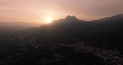 Silhouette of Mountains Against the Background of the Setting Sun