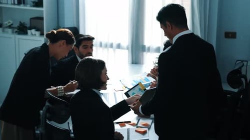 Top view of business people looking at financial chart from tablet. Directorate.