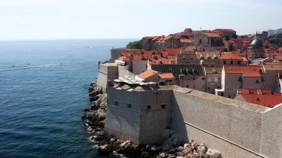 Cover for Dubrovnik Old City - Ancient City Walls In Dubrovnik, Croatia - aerial drone shot