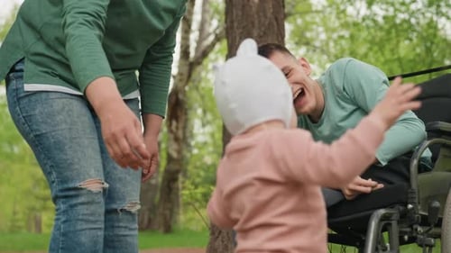 Family Time: Infant Taking First Steps in Park