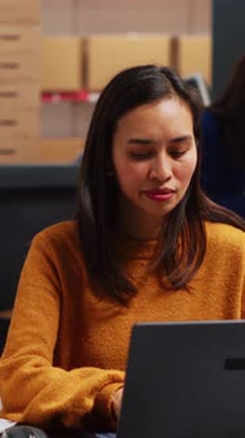 Vertical Video Woman Entrepreneur Checking Stock Production on Pc