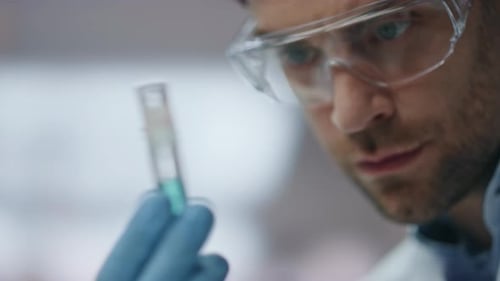 Biotechnology Researcher Looking Test Tube with Innovation Medicines Close Up