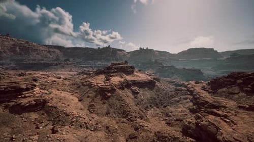 Stunning Desert Landscape with Rocky Formations Under a Bright Sky at Midday