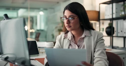 Professional Woman Working at Computer in Modern Office