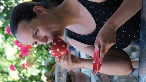 Woman Enjoying a Cup of Tea Outside