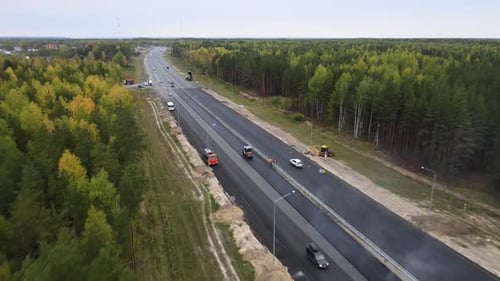 Repair of a section of the highway and laying asphalt with road equipment