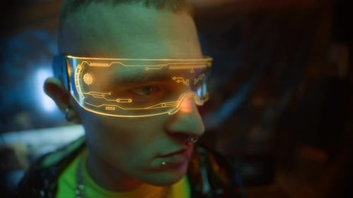 Man Wearing Futuristic Glasses in Dark Interior