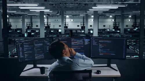 Tired Asian Man Developer Yawning Before Sleeping While Write Code In Data Center