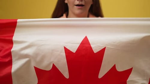 Young Woman with Canadian Flag Celebrating