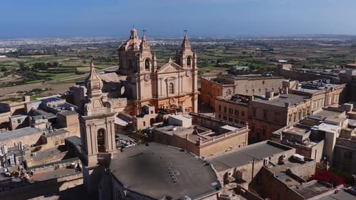 Aerial Sweep of Mdina Malta and St Pauls Cathedral in Warm Light