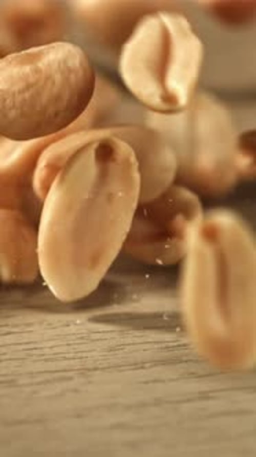 Peanuts Fall on the Table Filmed on a Highspeed Camera at 1000 Fps
