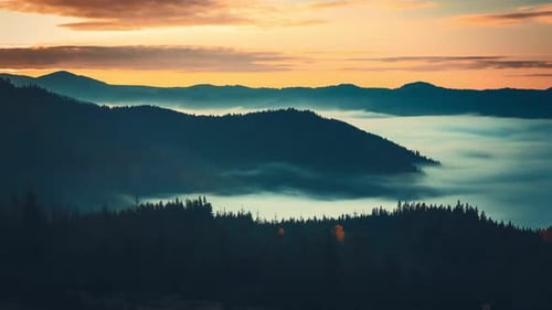 Sunrise Illuminating Foggy Mountain Ranges in the Carpathians Ukraine