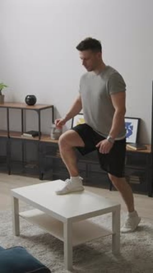 Young Man Exercising in His Living Room