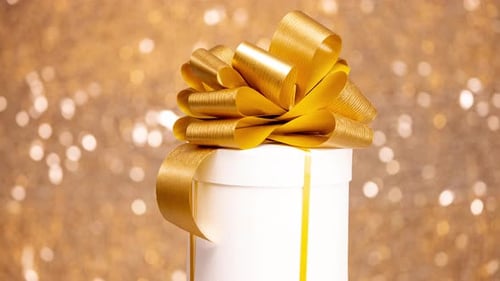 Elegant Present with Golden Bow Rotating