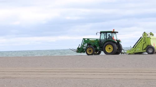 Tractor grooming a beach
