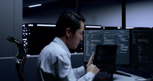 Focused Coder Works at Modern Tech Workplace