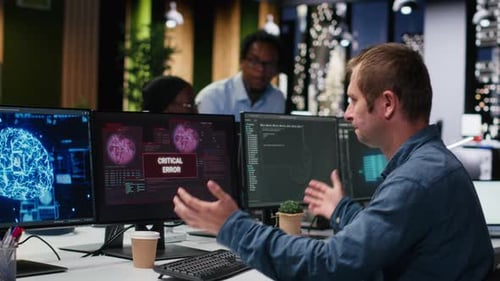 Software Developer in Office Receiving Critical Error Warning