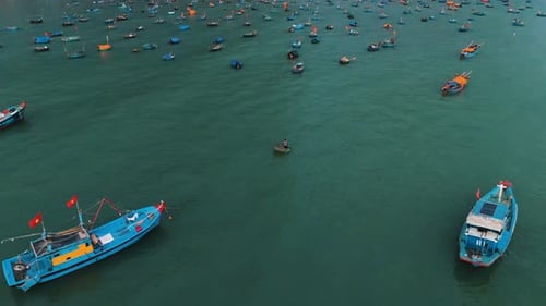 Aerial View of Colorful Fishing Boats on Ocean