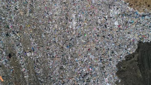 Aerial Top Down View of Large Garbage Landfill Trash Dump Flocks of Birds Circling Over the Garbage