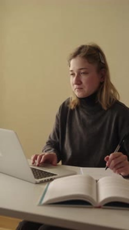Vertical Portrait of Student Freelancer with Cerebral Palsy Engaging in Business Studying on Laptop