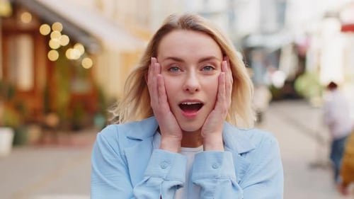 Woman Expresses Surprise on City Street