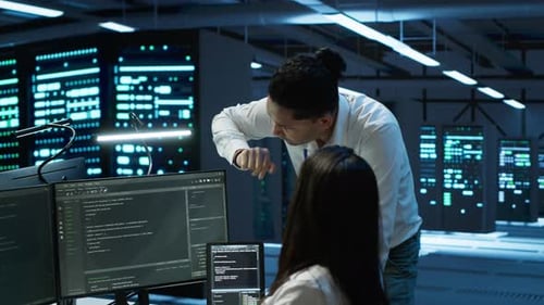 Engineering Team Colleagues in Data Center Managing Gear Energy Consumption