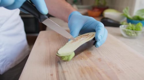 Chef Prepares Stuffed Eggplant Vegetable Dish