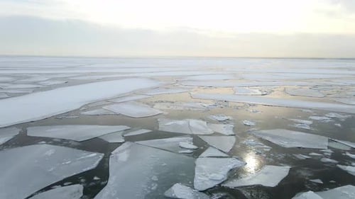 Establishing shot ocean surface completly frozen with ice formations