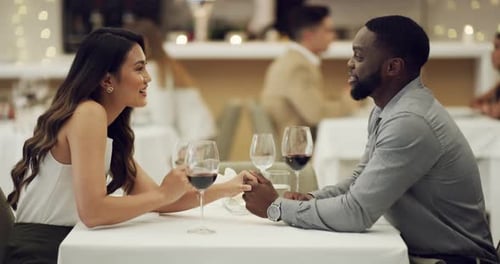 4k video footage of a happy young couple having a romantic date at a fancy restaurant