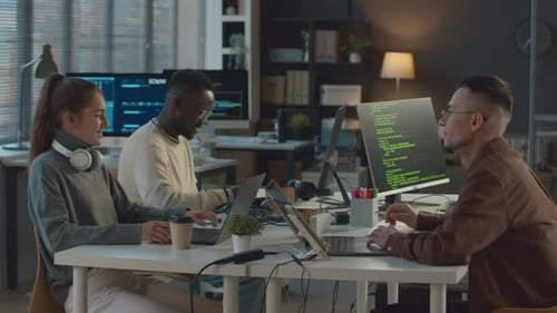 Diverse Team of Programmers Co-working in Office