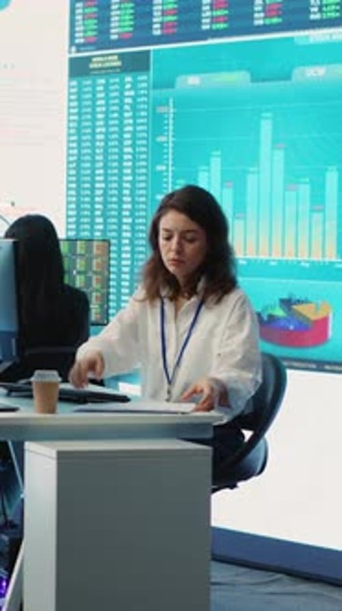 Vertical Video Business Specialist Reviewing Key Performance Indicators Within Firm Activity