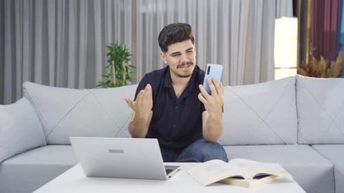 Man Having a Cheerful Video Call at Home