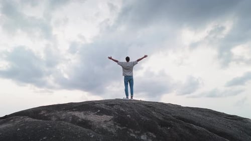 Man Standing at Hill Arms Outstretched Tranquility Freedom Cloudy Sky Clouds Person at Hill