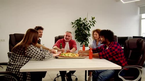 Group of Friends Drinking and Eating Pizza Together Laughing Coworkers Enjoying Fast Food in Office