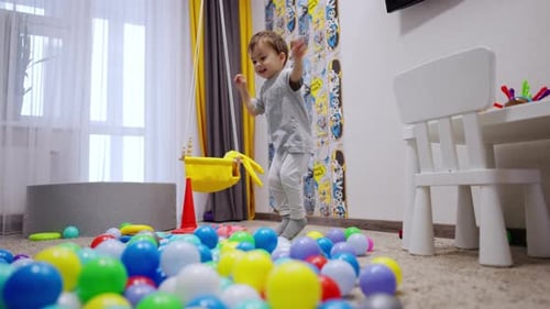Young Child Playing with Toys in Bright Room