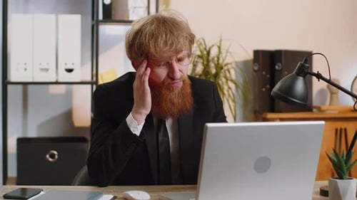 Tired Young Business Man Suffering From Headache Problem Tension Migraine Stress at Home Office