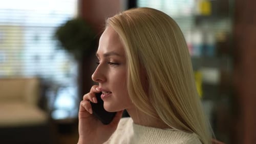 Closeup Face of Confident Serious Business Woman Having Work Call in Cafe Using Mobile Phone